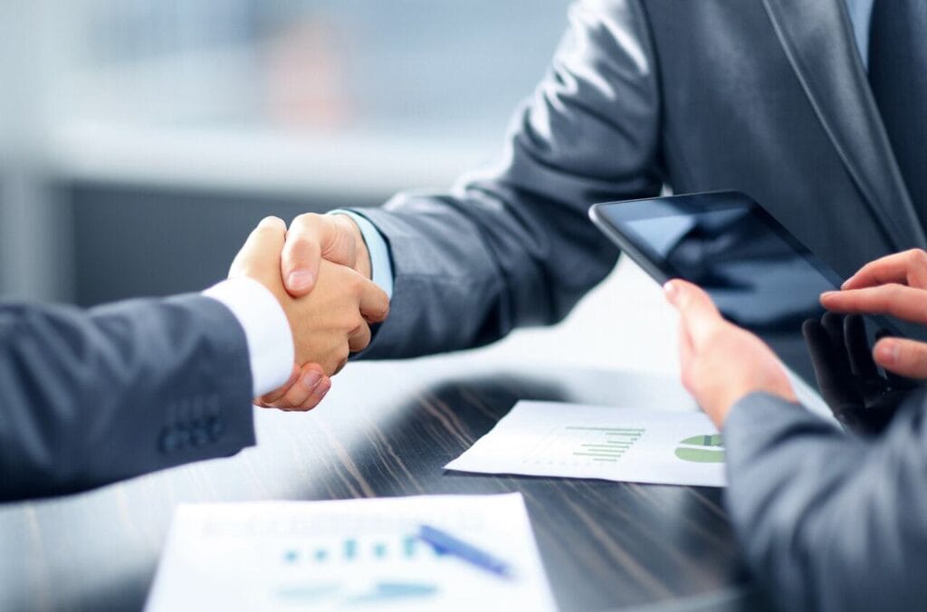 Business handshake closing an investment in Paraguay