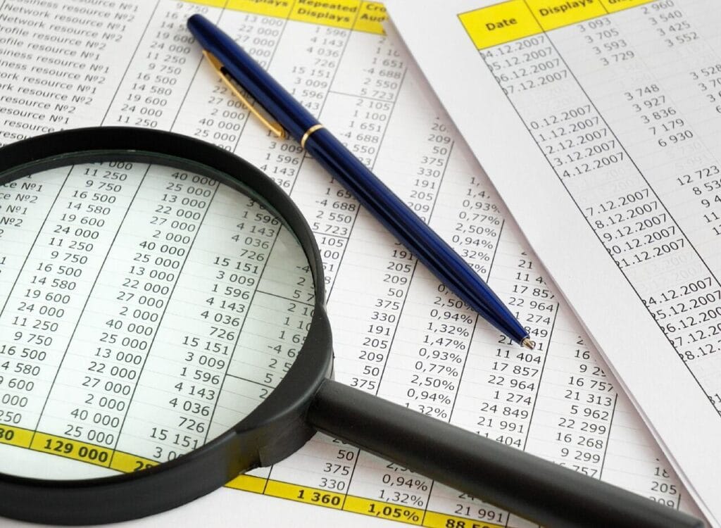 Reviewing tax documents with a magnifying glass